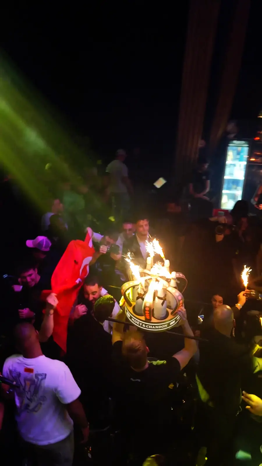 A champagne display with sparklers carried through the crowd at COCO club, Brussels.